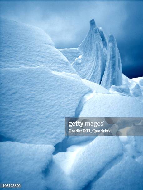 toned image of avalanche and snow sculpture - snow sculpture stock pictures, royalty-free photos & images