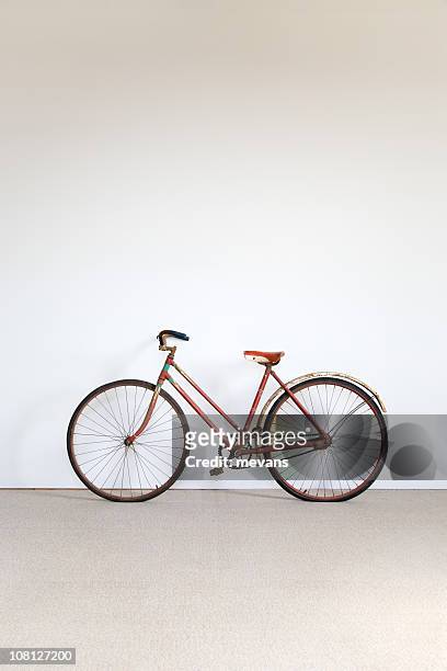 bicycle against wall - bike pedal stock pictures, royalty-free photos & images