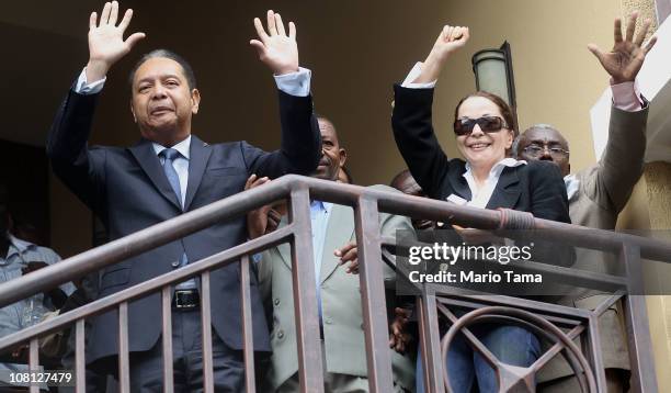 Jean-Claude Duvalier , the former Haitian leader known as 'Baby Doc', waves as he is taken into custody by Haitian police with his girlfriend...