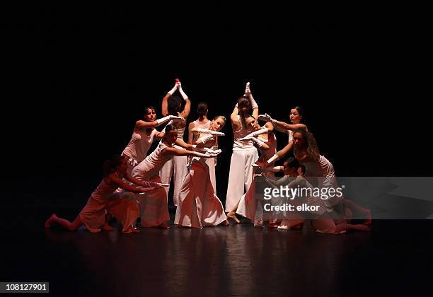 contemporary female dancers on stage - performance stock pictures, royalty-free photos & images