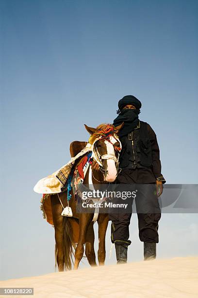 man in desert with horse - berber stock pictures, royalty-free photos & images