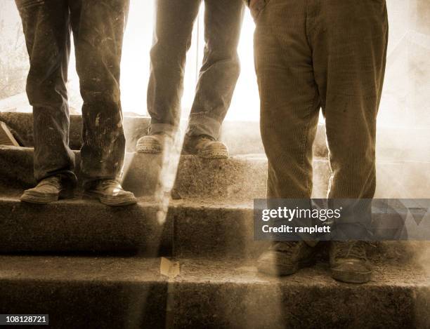 dusty and feet at a construction site - work boot stock pictures, royalty-free photos & images