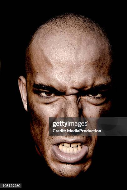 Angsty Look Portrait Of Angry Mans Face Against Dark Background High-Res Stock ...