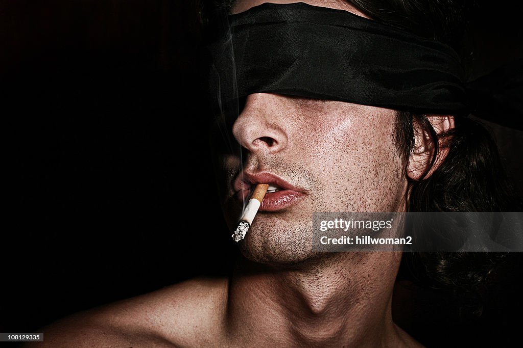 blindfold and a cigarette firing squad Blindfolded Man Awaits The Firing Squad Smoking His Last Cigarette Stock Photo Cigarettes in Persepolis | Shmoop