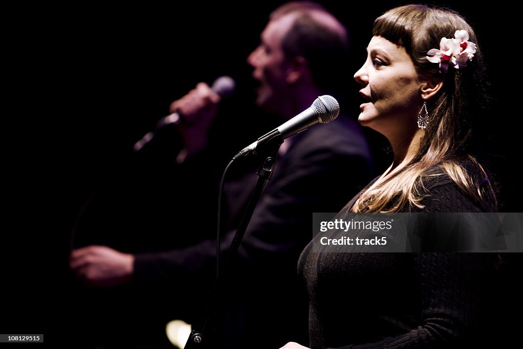 Duet between a male and female vocalist live on stage