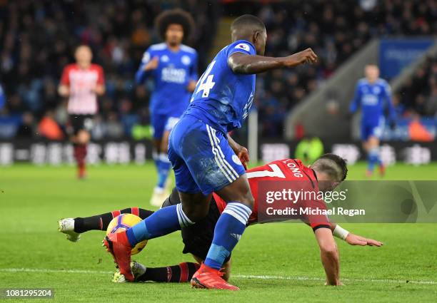 Nampalys Mendy of Leicester City fouls Shane Long of Southampton, conceding a penalty during the Premier League match between Leicester City and...