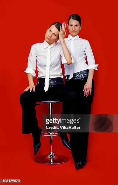 twin girls dressed in men's clothes - black transvestite stock pictures, royalty-free photos & images