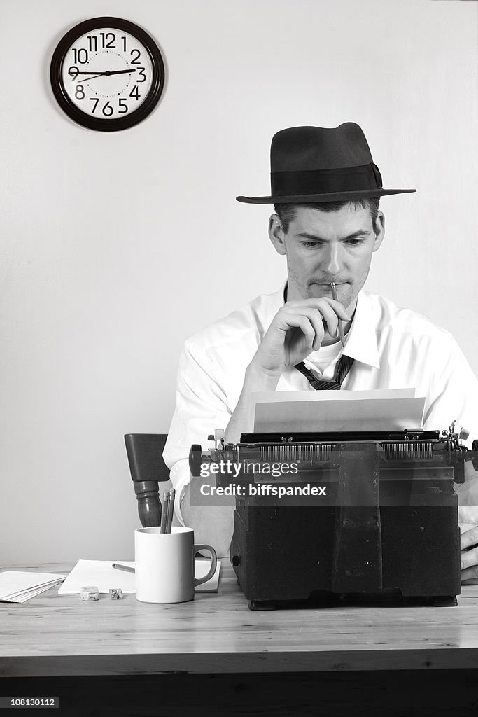 Old Style Man Reporter Sitting at Typewriter, Black and White