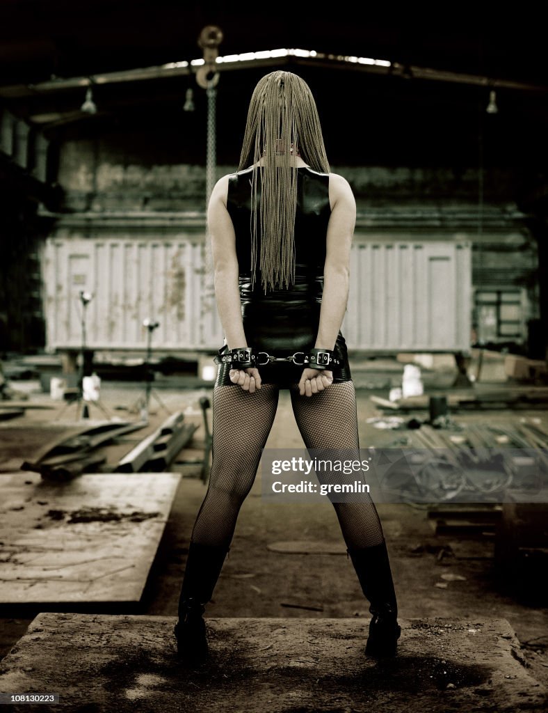 Handcuffed Young Woman in Abandoned Factory