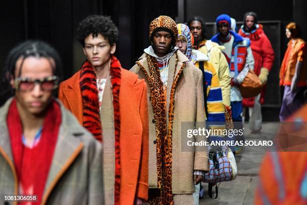 Models present creations for fashion house Marni during the Men's Fall/Winter 2019/20 fashion shows in Milan, on January 12, 2019.