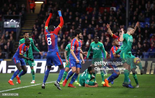 The ball rebounds off Craig Cathcart of Watford as Crystal Palace score their team's first goal during the Premier League match between Crystal...