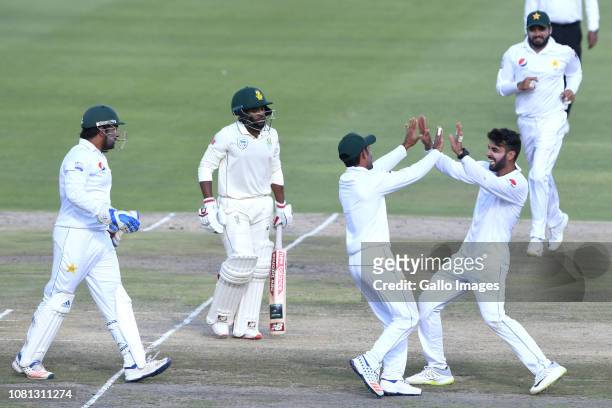 Shadab Khan of Pakistan celebrates the wicket of Temba Bavuma of the Proteas with his team mates during day 2 of the 3rd Castle Lager Test match...