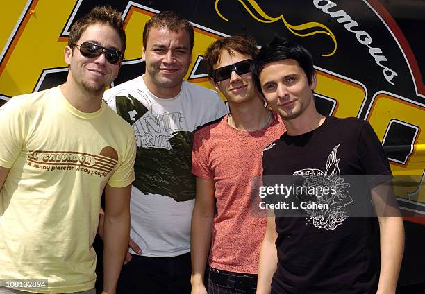 Stryker of KROQ with Chris Wolstenholme, Dominic Howard and Matthew Bellamy of Muse
