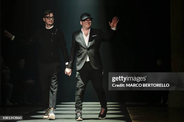 Designers Tom Notte and Bart Vandebosch acknowledge applause following the presentation of the Men's Fall/Winter 2019/20 fashion collection they...