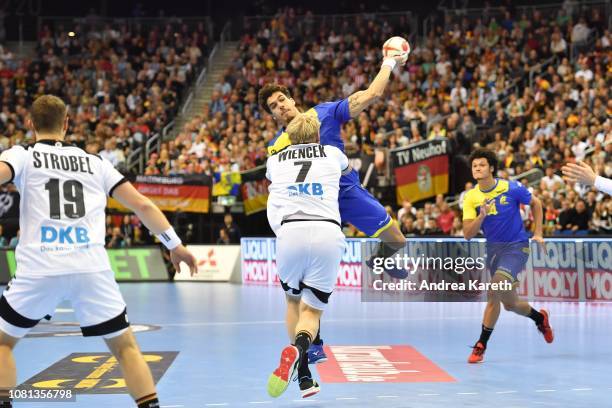 Jose Toledo of Brazil ist challenged by Patrick Wiencek of Germany during the Group A match of 26th IHF Men's World Championship between Germany and...