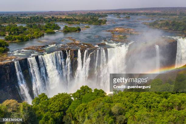 aerial view of famous victoria falls, zimbabwe and zambia - zimbabwe stock pictures, royalty-free photos & images