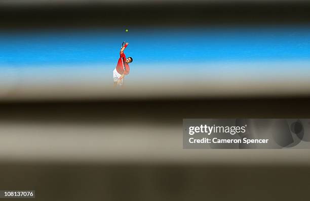 Janko Tipsarevic of Serbia serves in his second round match against Fernando Verdasco of Spain during day three of the 2011 Australian Open at...