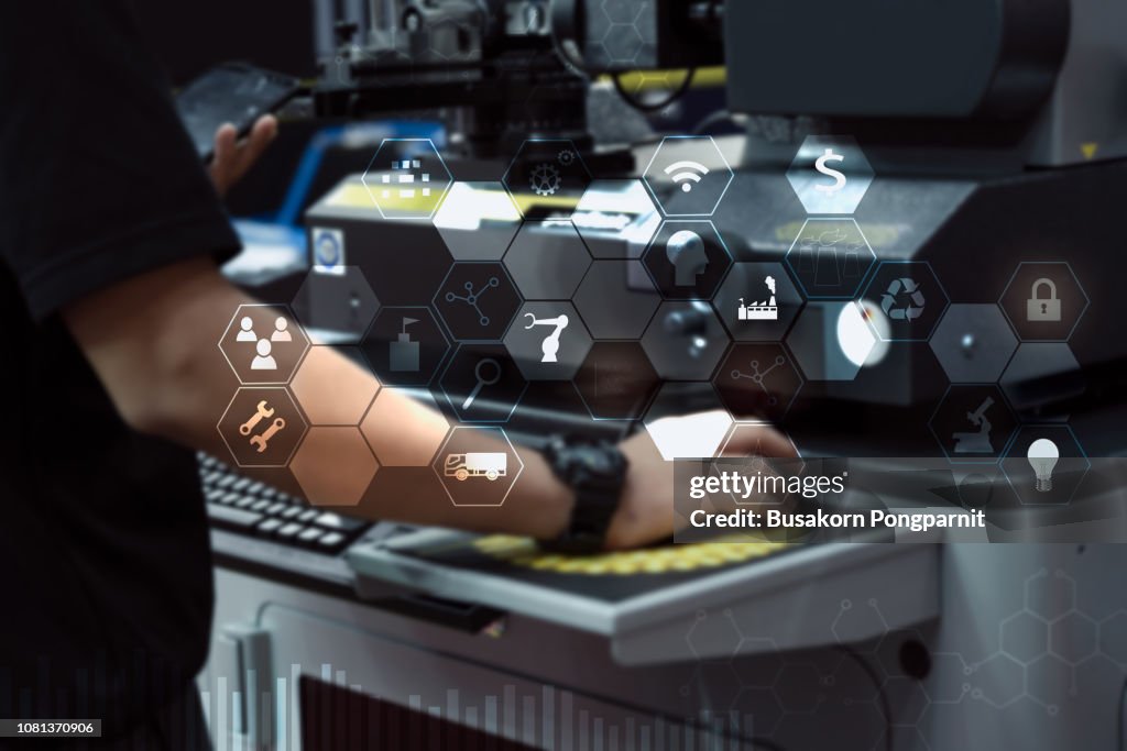 Engineer or Technician man with business industrial tool icons, engineer using tablet with industrial business concept. Industry 4.0 concept