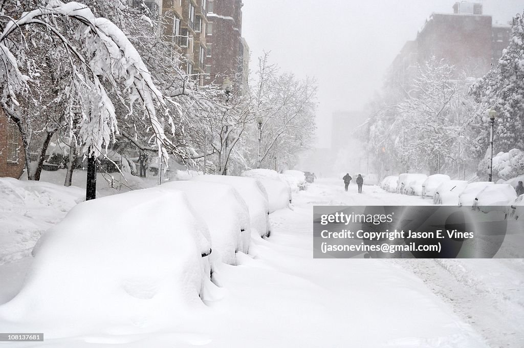 Block of snow-covered cars