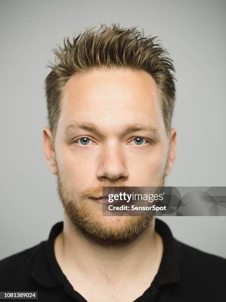 real caucasian man with blank expression - guy with spiky hair stock pictures, royalty-free photos & images