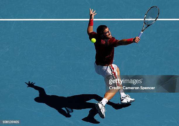 Janko Tipsarevic of Serbia plays a backhand during his second round match against Fernando Verdasco of Spain during day three of the 2011 Australian...