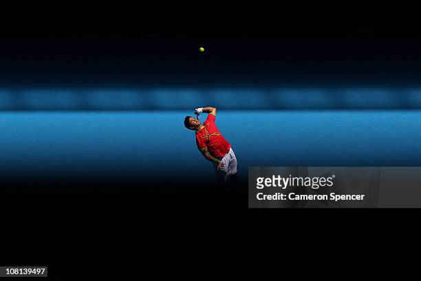 Fernando Verdasco of Spain serves in his second round match against Janko Tipsarevic of Serbia during day three of the 2011 Australian Open at...