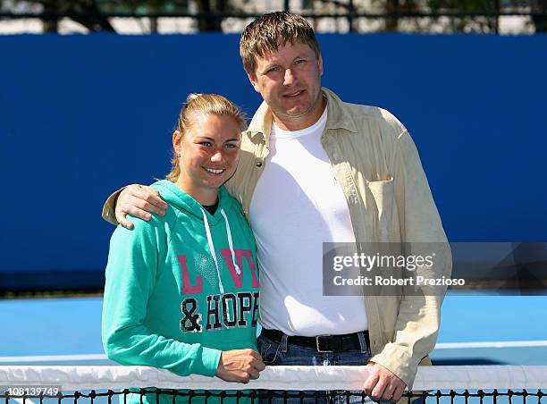 Vera Zvonareva of Russia poses with former tennis player Yevgeny Kafelnikov during day three of the 2011 Australian Open at Melbourne Park on January...