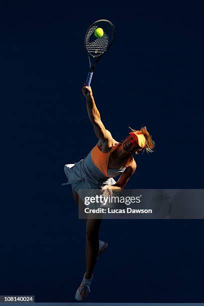 Maria Sharapova of Russia serves in her second round match against Virginie Razzano of France during day three of the 2011 Australian Open at...