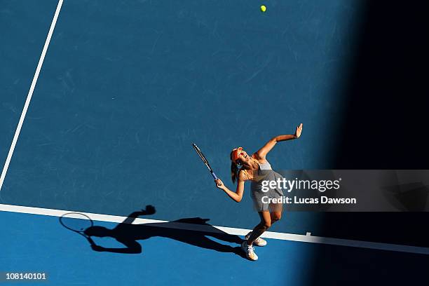 Maria Sharapova of Russia serves in her second round match against Virginie Razzano of France during day three of the 2011 Australian Open at...