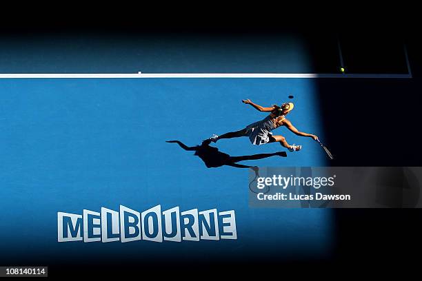 Maria Sharapova of Russia plays a forehand in her second round match against Virginie Razzano of France during day three of the 2011 Australian Open...