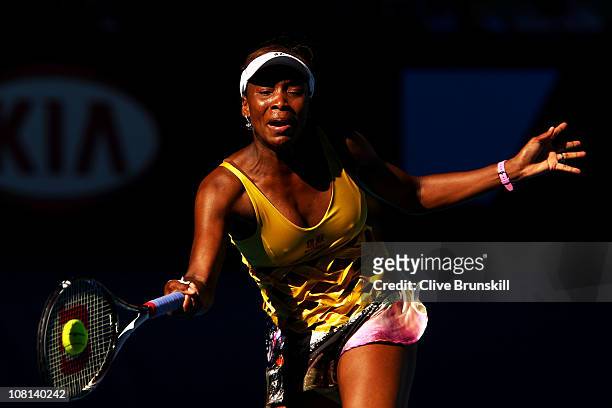 Venus Williams of the United States of America plays a forehand in her second round match against Sandra Zahlavova of the Czech Republic during day...