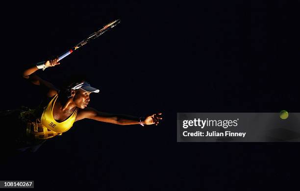 Venus Williams of the United States of America serves in her second round match against Sandra Zahlavova of the Czech Republic during day three of...