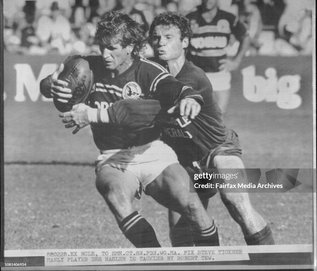 Manly Player Des Hasler is tackled by Robert Tew.