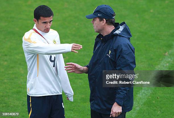 Tim Cahill talks with coach Holger Osieck during an Australian Socceroos AFC Asian Cup training session at Al Wakrah Stadium on January 19, 2011 in...
