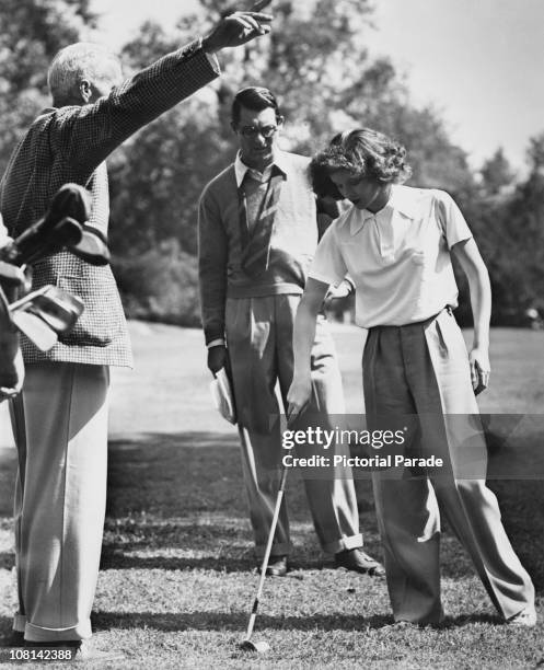 American director Howard Hawks with actors Cary Grant and Katharine Hepburn on the set of 'Bringing Up Baby', 1937.