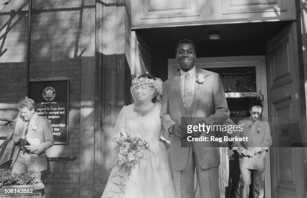 British comedians Dawn French and Lenny Henry at their wedding at St Paul's, Covent Garden, London, 21st October 1984.