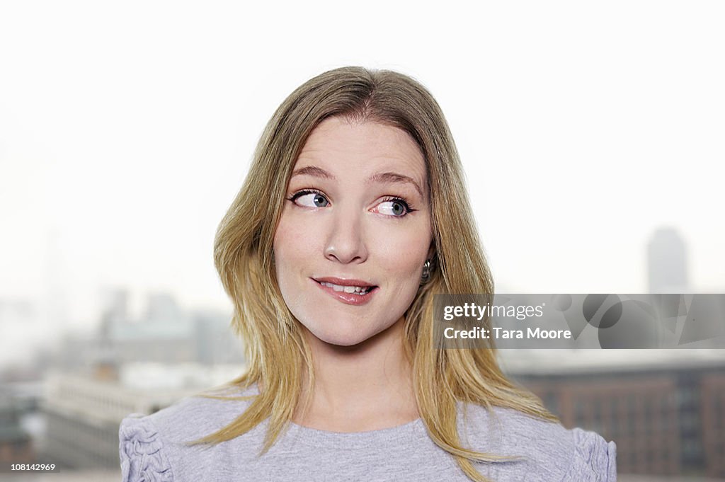 Young woman looking uncertain