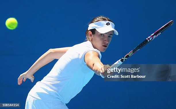 Alberta Brianti of Italy plays a backhand in her second round match against Dominika Cibulkova of Slovakia during day three of the 2011 Australian...