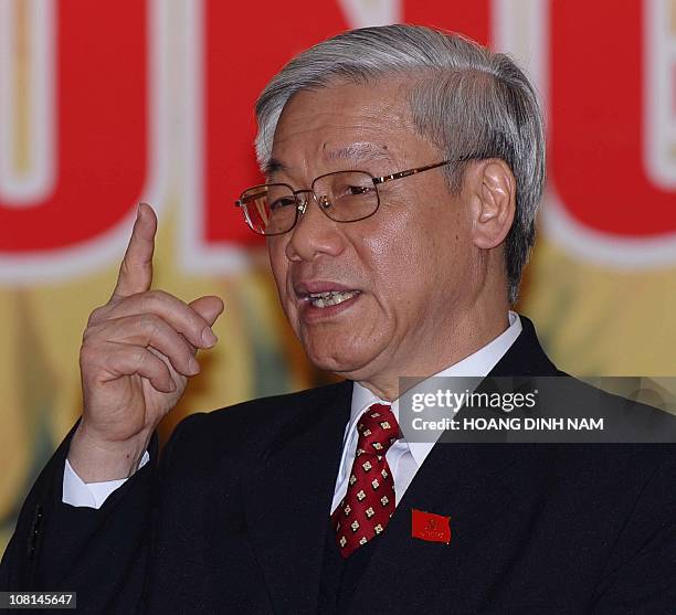 Vietnam Communist Party's newly elected Secretary General Nguyen Phu Trong answers questions during a press conference at the end of the closing...