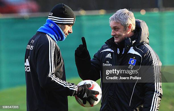 Head coach Armin Veh and Ruud van Nistelrooy chat during the training session of Hamburger SV on January 19, 2011 in Hamburg, Germany.