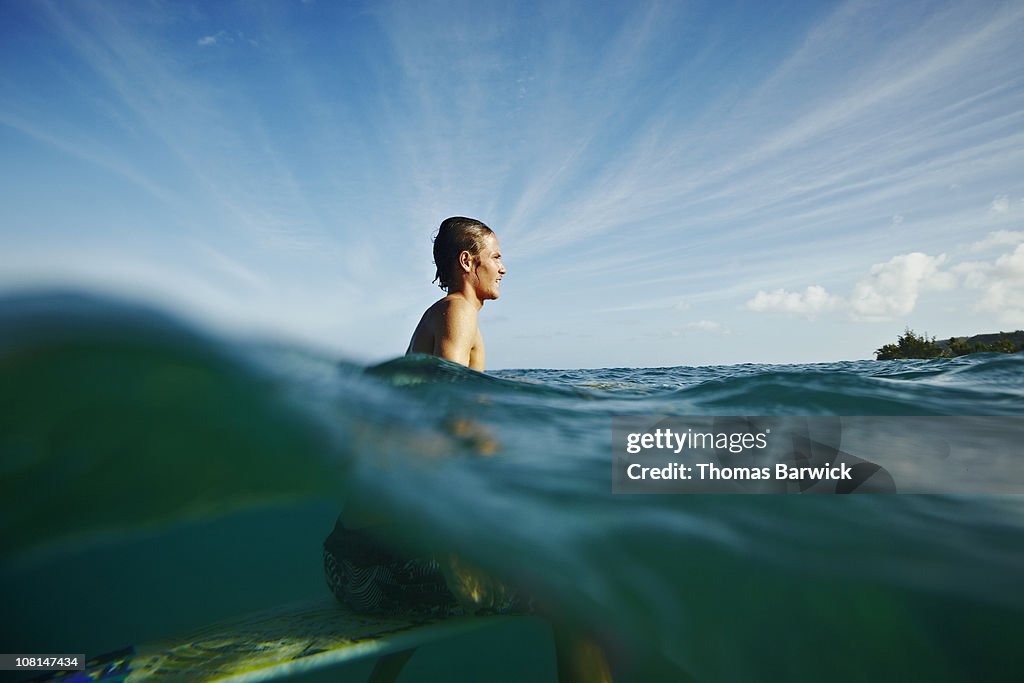 Surfer waiting to catch wave view from water