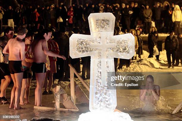 Russian Orthodox faithful plunge in the icy waters of a pond in celebration of the Epiphany holiday early on January 19, 2011 in Moscow, Russia....