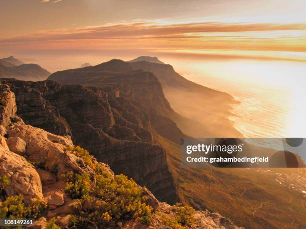 sunset over camps bay - camps bay stock pictures, royalty-free photos & images