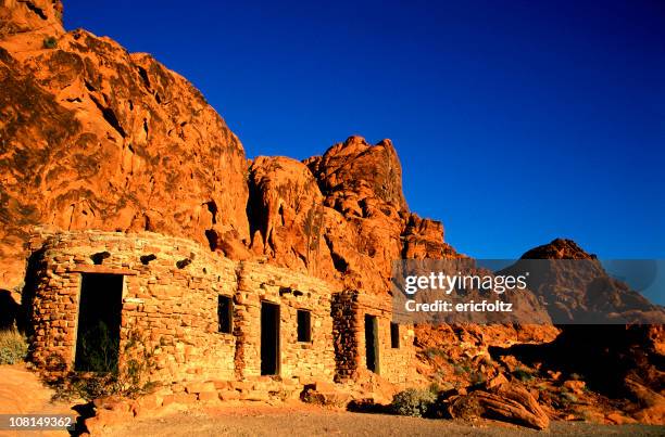 stone cabins built on the side of desert rock cliffs - valley of fire state park stock pictures, royalty-free photos & images