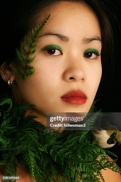 young woman wearing plants - green eyeshadow stock pictures, royalty-free photos & images