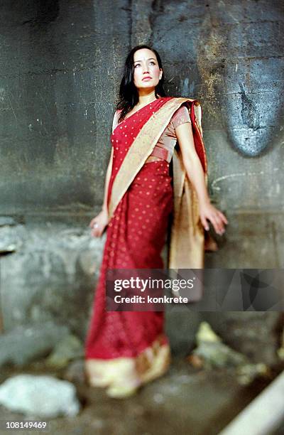 goddess of urban decay - woman in red sari stock pictures, royalty-free photos & images