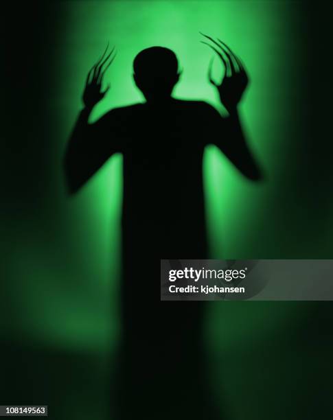 halloween spooky green alien vampire - vampire silhouette stock pictures, royalty-free photos & images