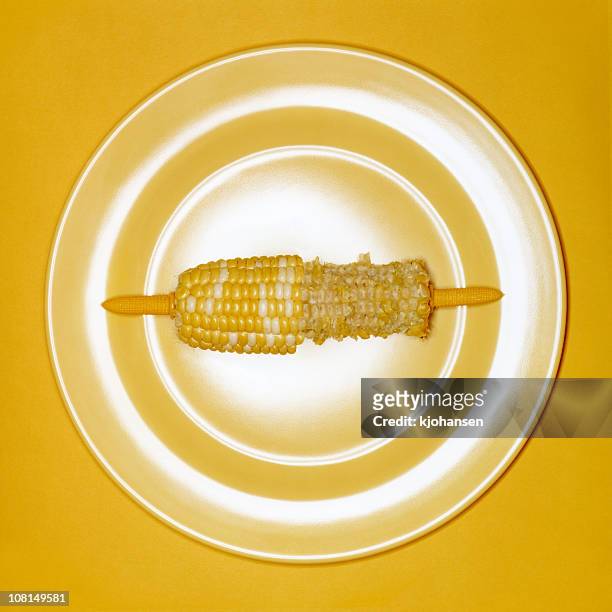 half-eaten corn on the cob - corn cob stock pictures, royalty-free photos & images