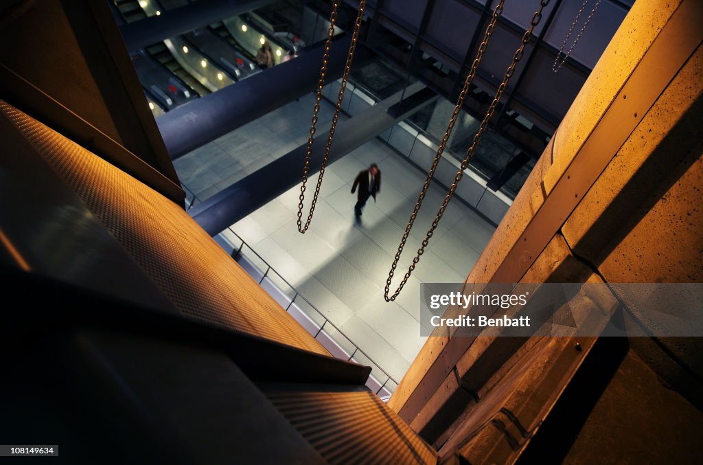 Man Walking in Underground Train Station, View from Above