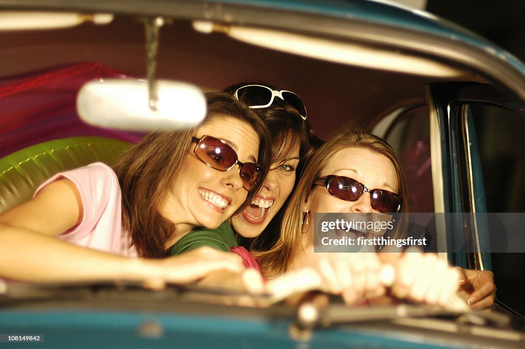 Portrait of Three Young Women Driving in Car